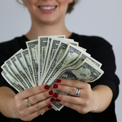 The image depicts a woman holding a handful of money, symbolizing financial resources and wealth. Her expression suggests a combination of satisfaction and responsibility, perhaps reflecting the importance of effective money management. The image could represent the concept of financial literacy, personal finance, or achieving financial goals. It might also convey the idea of taking control of one's finances and making informed financial decisions. The image depicts a woman holding a handful of money, symbolizing financial resources and wealth. Her expression suggests a combination of satisfaction and responsibility, perhaps reflecting the importance of effective money management. The image could represent the concept of financial literacy, personal finance, or achieving financial goals. It might also convey the idea of taking control of one's finances and making informed financial decisions. The image depicts a woman holding a handful of money, symbolizing financial resources and wealth. Her expression suggests a combination of satisfaction and responsibility, perhaps reflecting the importance of effective money management. The image could represent the concept of financial literacy, personal finance, or achieving financial goals. It might also convey the idea of taking control of one's finances and making informed financial decisions. Stock market blogs